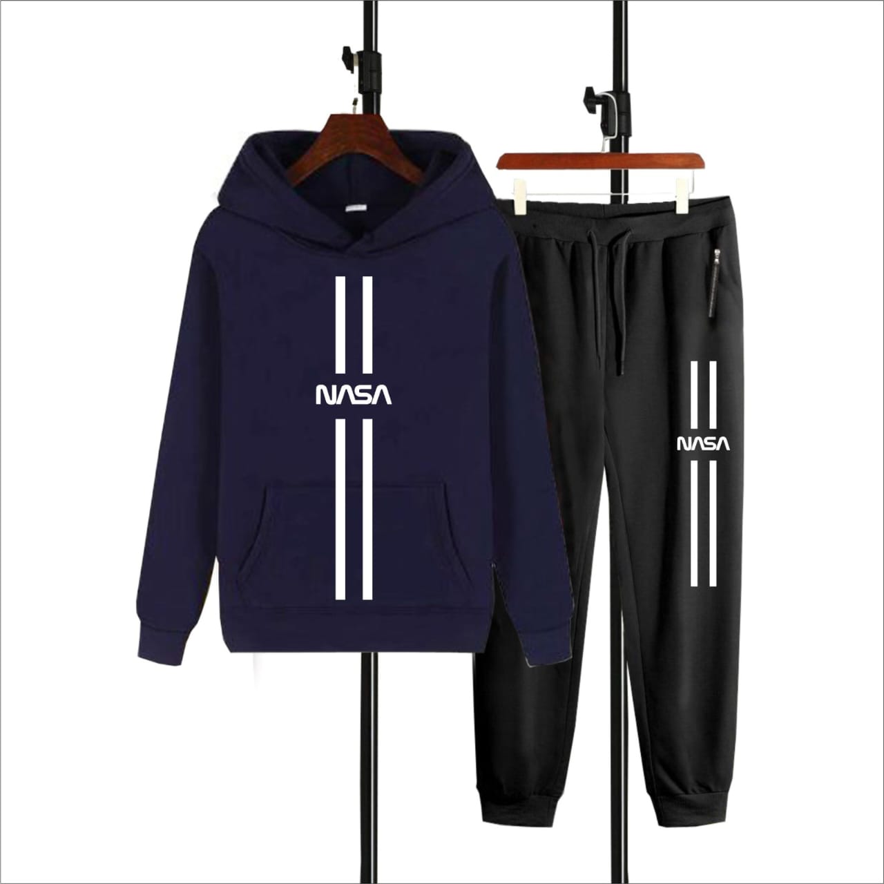 Navy hoodie and black pants set with NASA logo on hangers against a white background